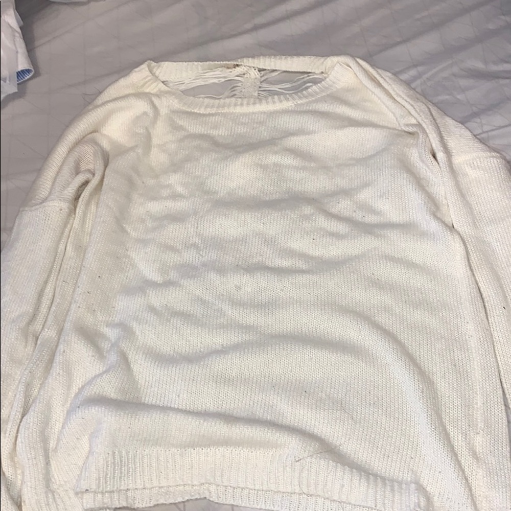 White ripped sweater